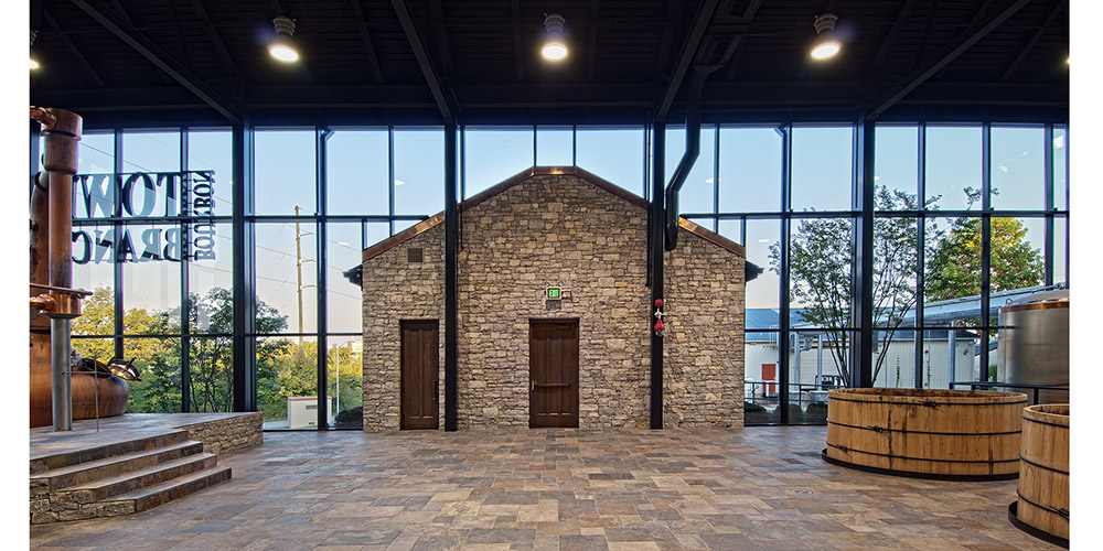 Steel building distillery with glass curtain walls