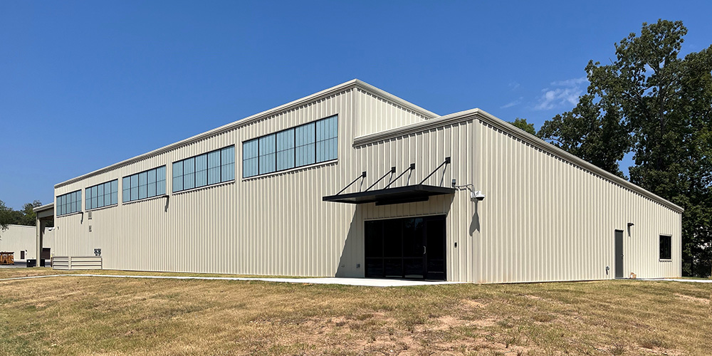 Single slope metal building with lean-to
